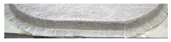 Stratifications successives de mat de verre