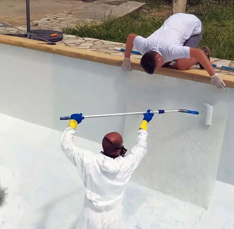 Stratification piscine pose du tissu technique